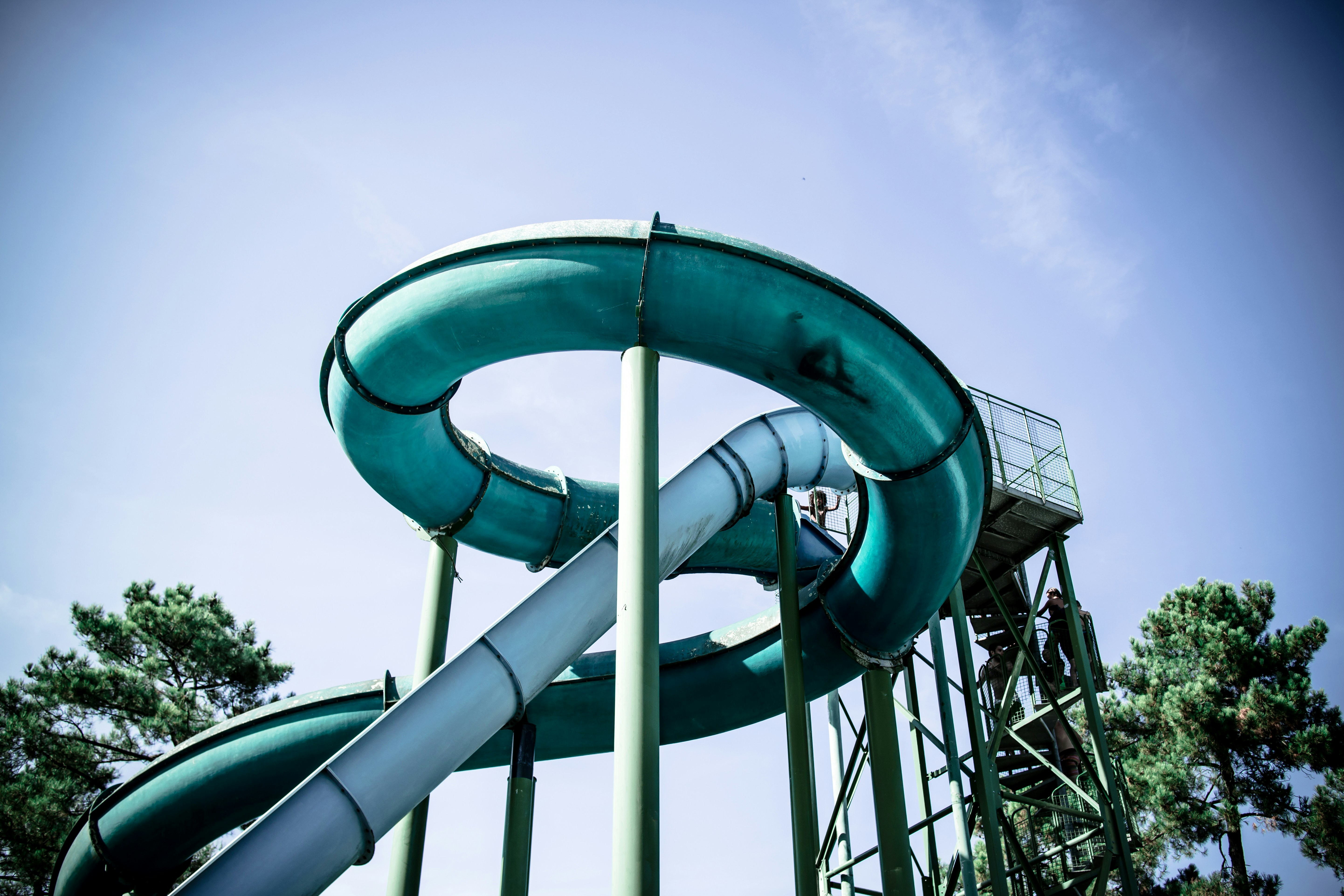 Image of a slide with kids climbing and playing